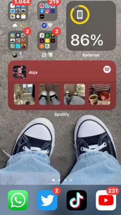 someone's feet are shown in front of an iphone screen