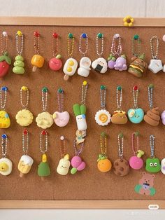 a cork board with many different types of buttons attached to the pegs on it