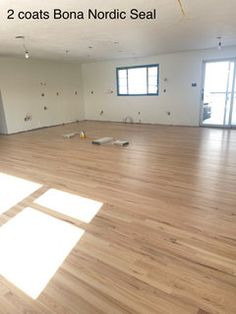 an empty room with hard wood flooring and no one in the room to see