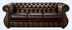 a brown leather couch sitting on top of a white floor