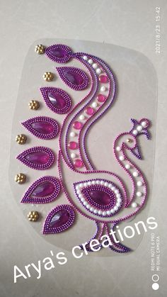 the beaded peacock is purple and white