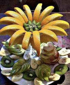 an arrangement of fruit arranged on a plate