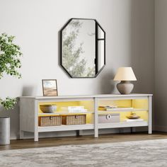 a living room with a mirror and yellow accents