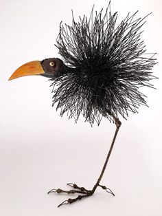 an odd looking bird made out of twigs