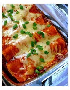 a casserole dish with cheese and green onions