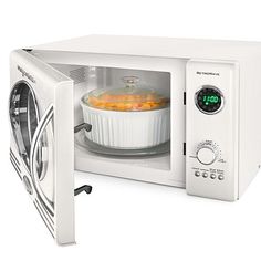 a white microwave oven with food in it