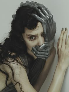 a woman with her hands on her face