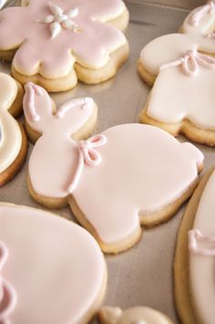 cookies decorated with pink icing and bows