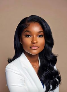 a woman with long black hair wearing a white suit