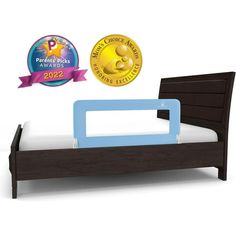 a wooden toddler bed with a blue frame