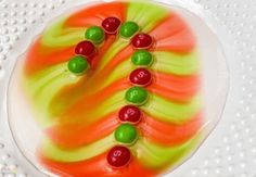 a cake decorated with candy and candies on a plate