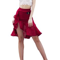 a woman in a red skirt and white top posing for the camera with her hands on her hips