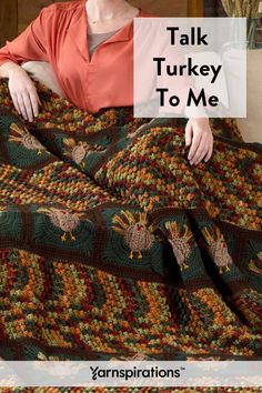 a woman sitting on a couch under a blanket with the words talk turkey to me