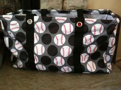 a black and white polka dot bag with baseballs on it