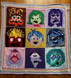 a crocheted blanket with cartoon characters on it