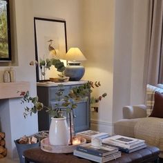 a living room filled with furniture and a fire place