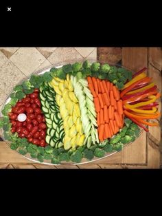 a platter filled with lots of different types of vegetables