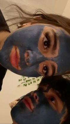 two people with face paint on their faces