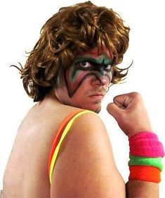 a man with his face painted like a wrestler