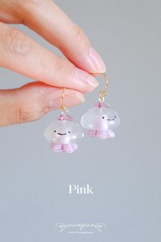 These adorable, hand-painted jellyfish earrings bring the charm of the ocean to your everyday look. Each earring features a delicate, translucent jellyfish with a smiley face, crafted with care and attention to detail. Lightweight and unique, perfect for ocean lovers or those who appreciate whimsical accessories. - Width: 3/4" | 1.9cm - Length: 1" | 2.5cm Find more design choices in jellyfish click the link bellow: https://www.etsy.com/shop/CiaoQiaoShop?ref=seller-platform-mcnav§ion_id=47654964 Translucent Jellyfish, Painted Jellyfish, Jellyfish Jewelry, Jellyfish Earrings, Princeton Nj, Whimsical Accessories, Earrings Cute, Happy Face, Smiley Face