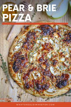 a pizza sitting on top of a wooden cutting board next to an apple and knife