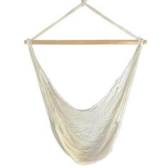 a white hammock hanging from a wooden hanger on a wall or ceiling