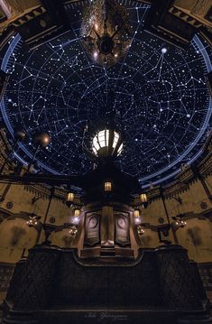 the inside of an old building with stars in the sky