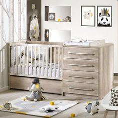 a baby's room is decorated in neutral colors