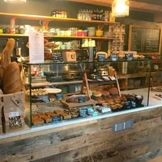 a bakery filled with lots of bread and pastries