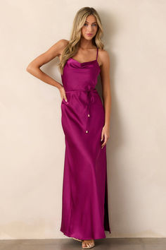 Light up the room in this Gleaming Glam Magenta Maxi Dress. It's classically beautiful with a hint of sass and a whole lot of elegance. Swish and swirl your way through the night in this show-stopper. Perfect for your next event! This magenta dress features a cowl neckline, adjustable straps, an adjustable self-tie belt with gold hardware, a slit reaching knee length on the left side, and a silky satin material throughout. Nights In White Satin, Magenta Dress, Halter Bridesmaid Dress, Red Dress Boutique, Black Dresses Casual, Little White Dresses, Satin Material, Event Dresses, Boutique Dresses