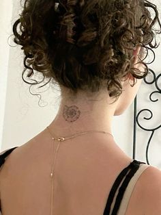 a woman with a tattoo on her back