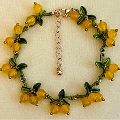 New Cute Glass Cloudberry Dangle Bracelet. Bracelet Is 8 Inches Long With A 2 Inches Extension. It Has A Lobster Claw Clasp. Adjustable Yellow Charm Bracelet Gift, Adjustable Yellow Charm Bracelet For Gift, Adjustable Yellow Charm Bracelet As A Gift, Casual Handmade Yellow Jewelry, Casual Yellow Handmade Jewelry, Yellow Casual Bracelet Jewelry, Casual Yellow Bracelet Jewelry, Yellow Beaded Charm Bracelet For Gift, Yellow Beaded Charm Bracelet Gift