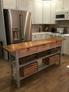 a kitchen island with two baskets on it