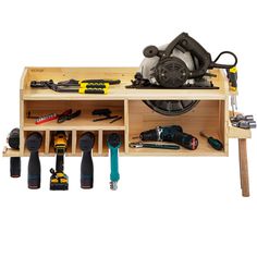 a workbench filled with tools on top of a wooden table