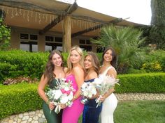 four beautiful young women standing next to each other