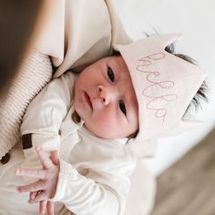 A pregnancy announcement, baby's first photo shoot or the perfect size for your little's favorite special stuffie, our baby crown is the sweetest accessory. Handcrafted from Oeko-Tex Certified Linen with a layer of batting for stability, these fabric crowns are available in a variety of colors. Madly Wish Linen Crowns are finished with a cotton twill tie. FEATURES Mini crown measures 7” wide with 8” ties Complimentary personalization available 100% pure European and Oeko-Tex Certified linen Made