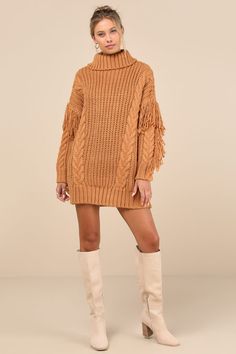 Winter's warmest must-have is hereâ€”the Lulus Coziest Heart Tan Oversized Cable Knit Fringe Sweater Mini Dress! This essential dress is composed of ultra-chunky knit that shapes a ribbed knit turtleneck and a relaxed-fit bodice with cabled details throughout. Boho-chic fringe trim runs across the dropped shoulders and down the outside edges of the long sleeves, ending at ribbed cuffs. Ribbed knit mini hem completes the look. Fit: This garment fits true to size. Length: Mid-thigh. Size medium measures 29.5" from shoulder to hem. Bust: Great for any cup size. Waist: Not Fitted - comfortable room throughout midsection. Hip: Not Fitted - room for hips. Undergarments: May be worn with any standard bra. Fabric: Fabric is very stretchy. Unlined. 100% Acrylic. Hand Wash Cold. Do Not Bleach. Hang Fall Cable Knit Sweater Dress, Fall Chunky Knit Sweater Dress, Cozy Cable Knit Dresses For Fall, Oversized Cable Knit Sweater Dress For Fall, Fall Cable Knit Dresses, Knitted Sweater Dress For Fall, Cozy Knitted Sweater Dress For Fall, Brown Knit Sweater Dress For Winter, Casual Chunky Knit Dresses For Fall