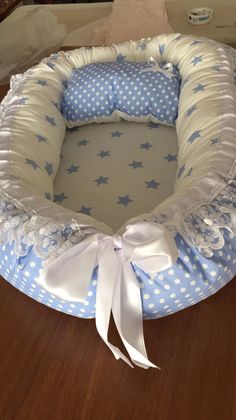 a blue and white baby bed with stars on it