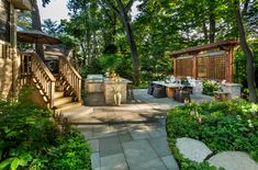 an outdoor kitchen and dining area is shown on the webpage for this homeownershiper