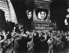 black and white photograph of people waving in front of the martin luther king memorial