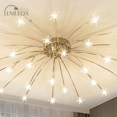 a ceiling light with stars on it in a living room