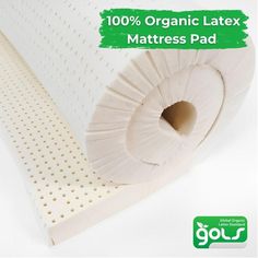 the organic latex mattress pad is made from foam and has been rolled up to be used