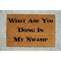 a door mat that says, what are you doing in my swamp?