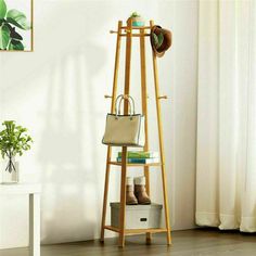 a wooden shelf with shoes and bags on it next to a white chair in front of a window