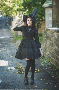 Victorian witch outfit featuring a black mourning dress by Gloomth. Find it on our site in sizes S-5XL #gloomth #witch #halloween #october #halloweenoutfit #witch #victorianwitch #victoriandress #victorianmourning #blackdress #gothicfashion #goth #gothic #gothicvictorian #alt Victorian Witch, Bat Necklace, Goth Model, Gothic Witch, Flowers Dress, Gothic Victorian, Witch Outfit, Victoria Dress, The Cult