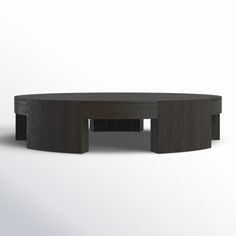 an oval coffee table with two sections on each side and one section at the end