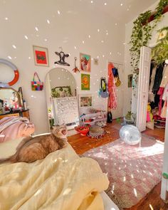 a cat is sitting on the floor in a bedroom