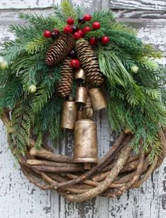 a christmas wreath with bells and pine cones