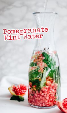 pomegranate mint water in a glass pitcher