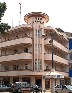 the building has many balconies on it's sides and is very tall